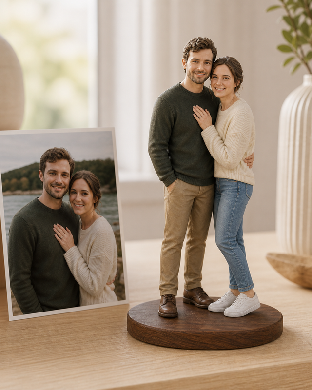 Full-colour 3D-printed resin couple figurines on a shared walnut base beside their source photo