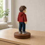 Rear three-quarter view showing the voxel figurine hood and block construction